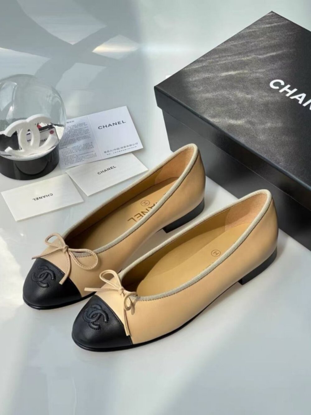 CHANEL Nude Black Bow Cap Toe Ballet Flats